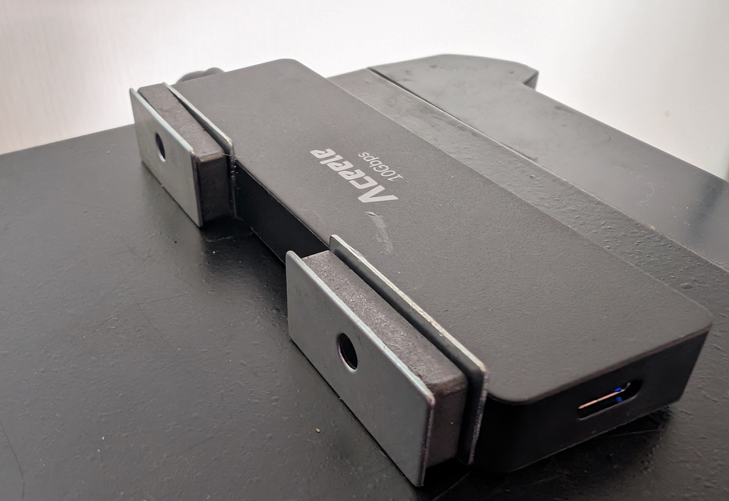 Square cabinet-door magnets glued to the sides of a USB hub